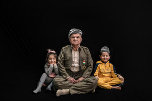 Mustafa Abdullah Hamad born in 1952, sat between his grandchildren He is one of the Kurdish heroes Peshmerga that all his life fighting for Kurdish people rights. four-time he got wounded in different battles ( Saddam and ISIL). He has a 75% disability.